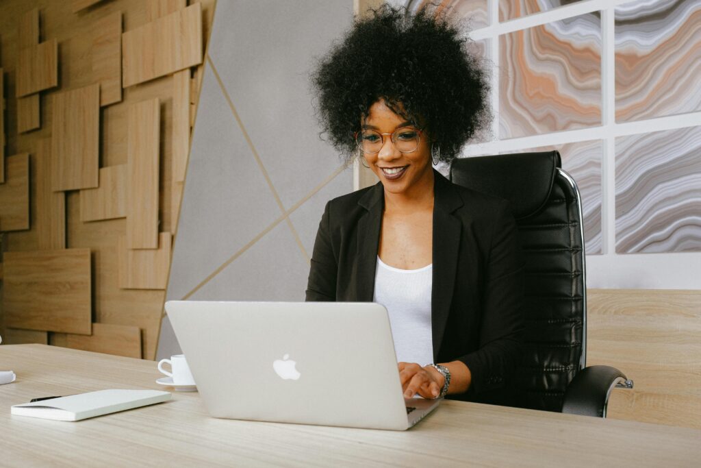 A client uploads documents on a laptop—illustrating how client portals offer a secure and efficient alternative to email-based document collection.