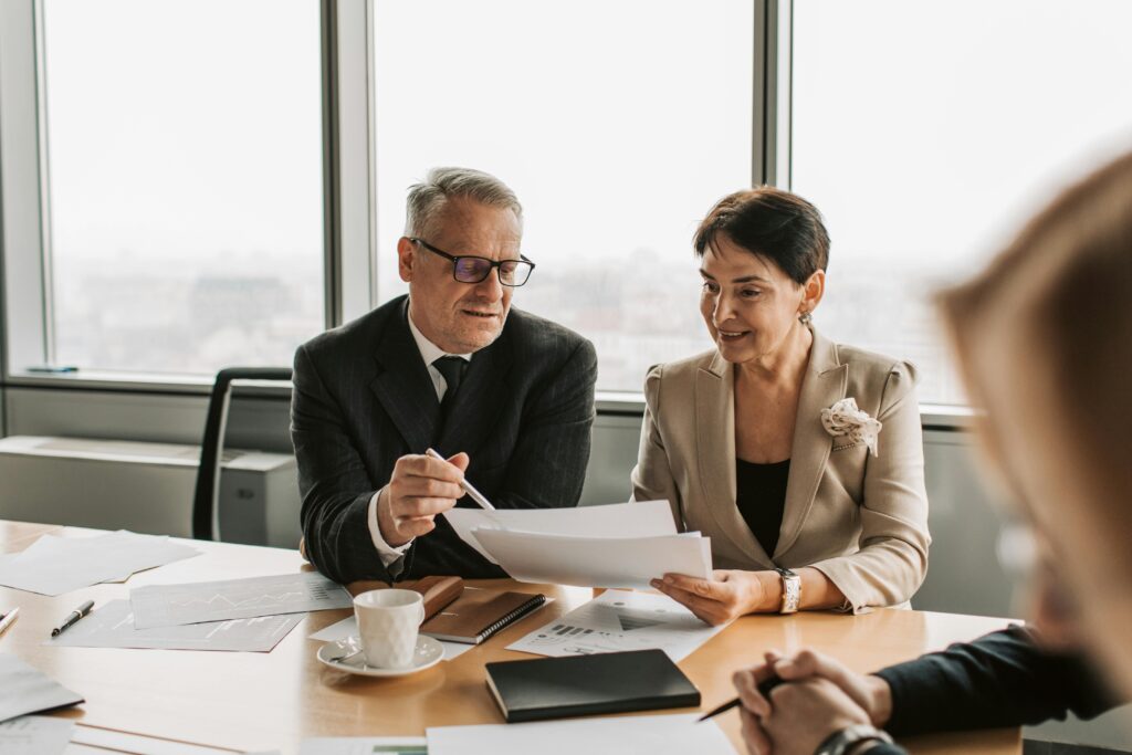 A tax advisor meeting with a client to evaluate investment losses and tax planning options.