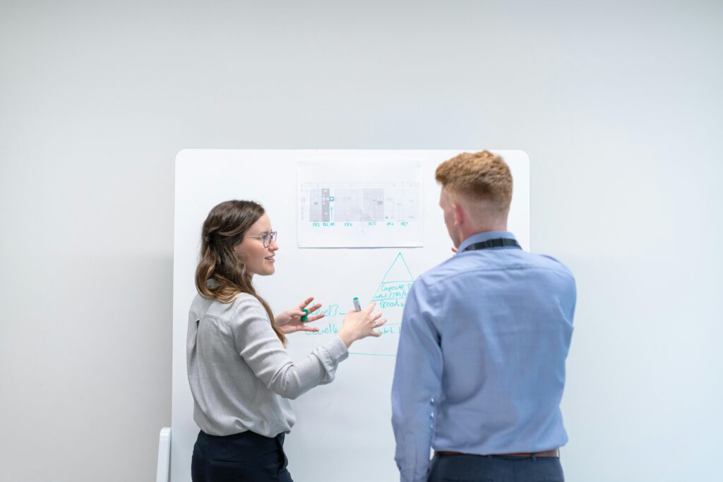 A female engineer holding a presentation in front of a group.