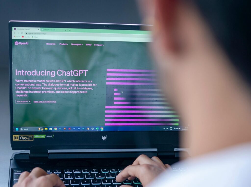 A man typing on a laptop, representing the use of ChatGPT in CPA firms.