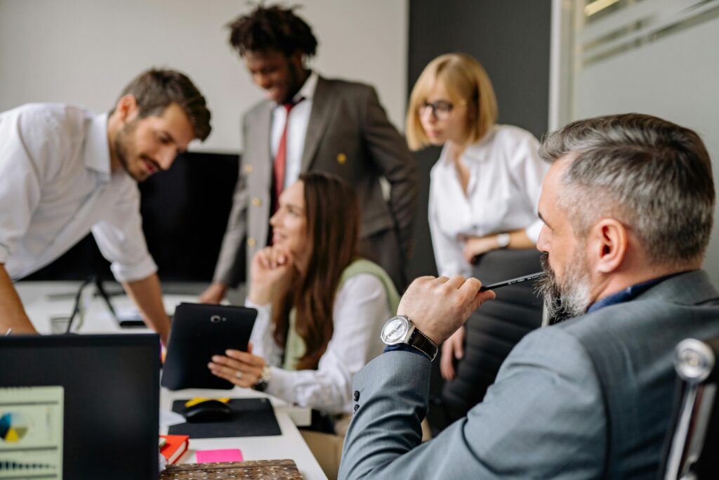 People in a meeting room discussing change management strategies for tax firms.